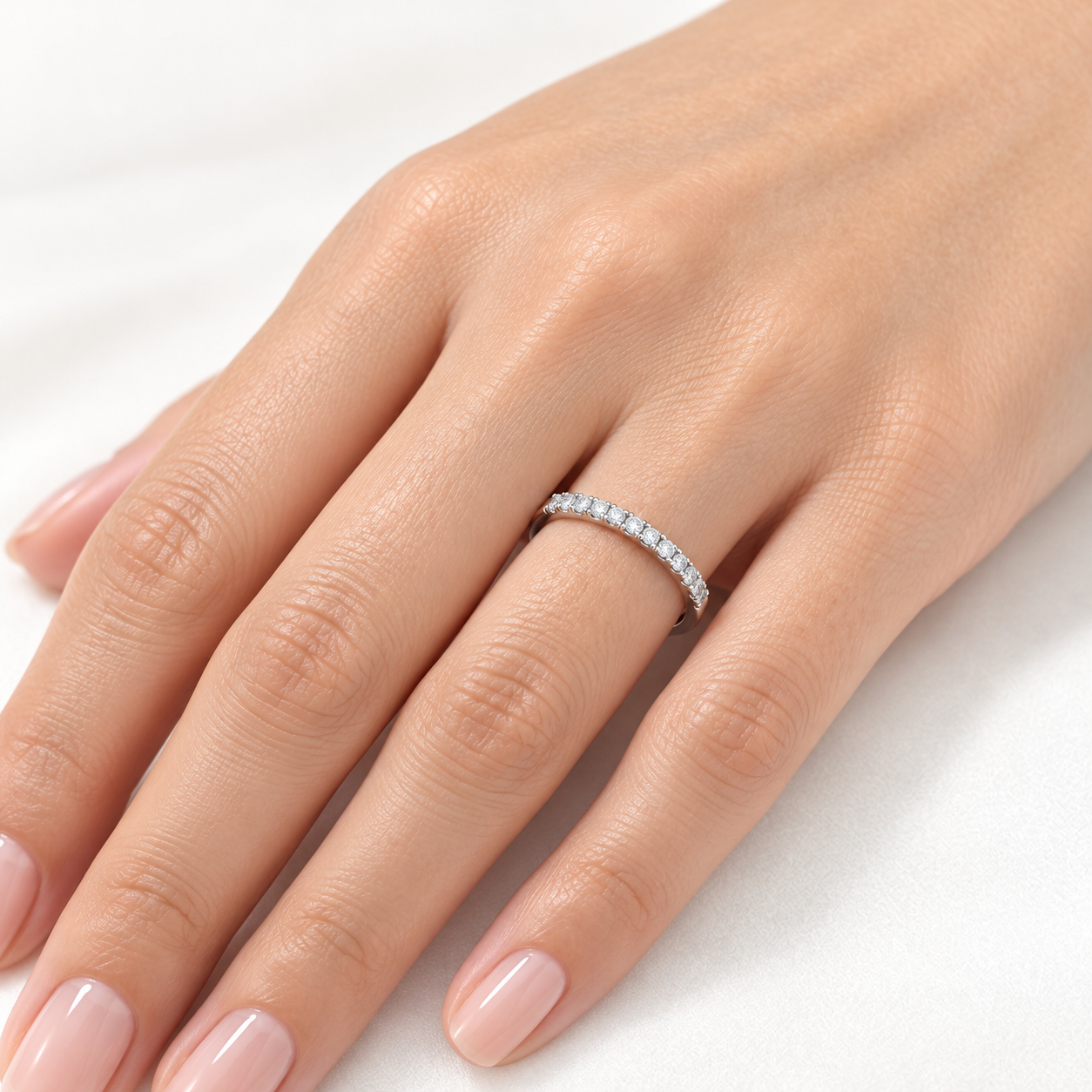 delicate stone set ring on woman's hand 1 delicate stone set ring on woman's hand 1
