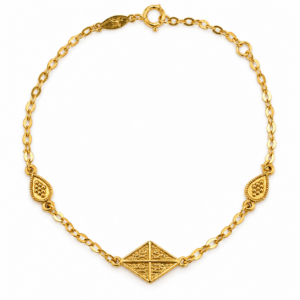 polished gold bracelet with byzantine diamond medallion