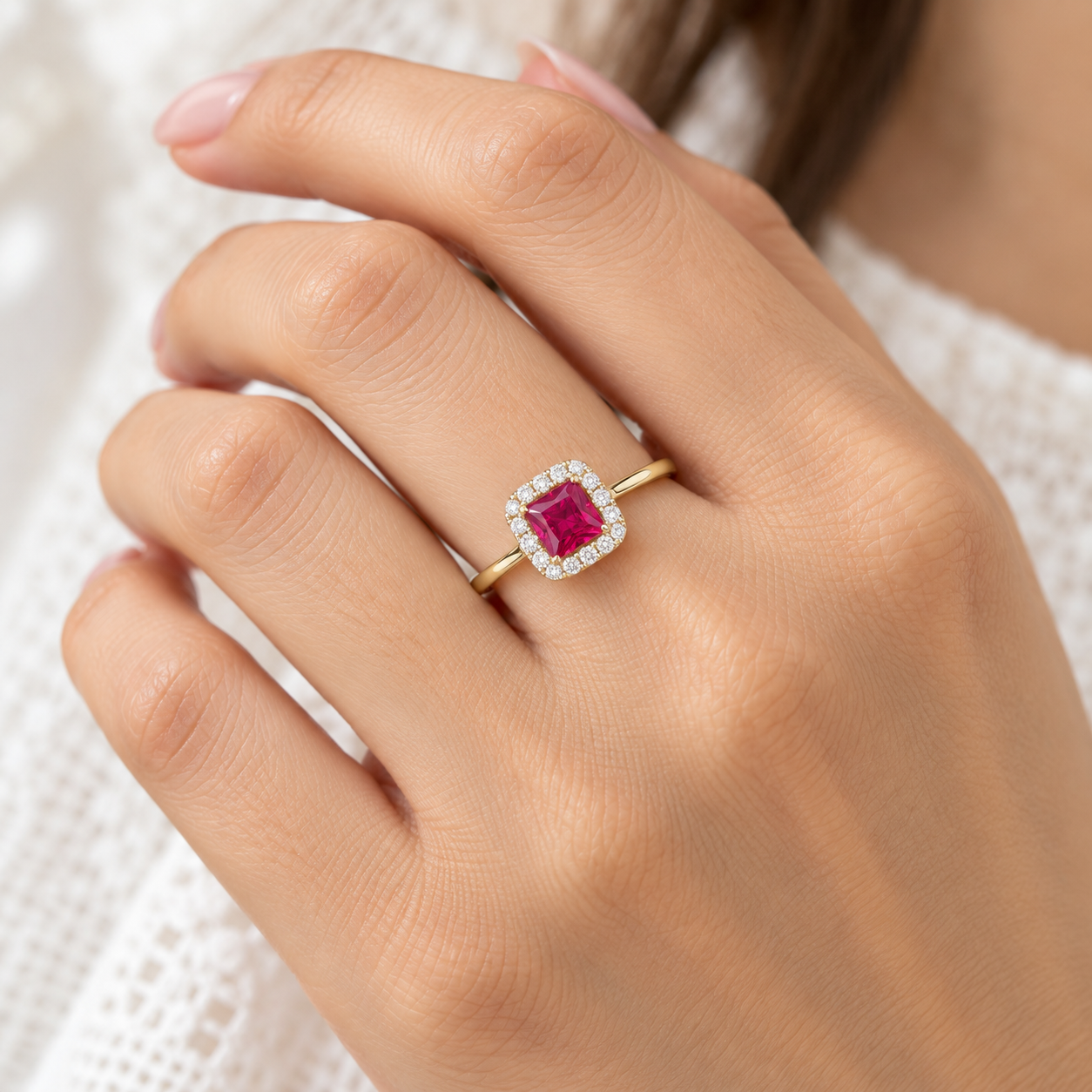 ruby halo ring on elegant hand ruby halo ring on elegant hand